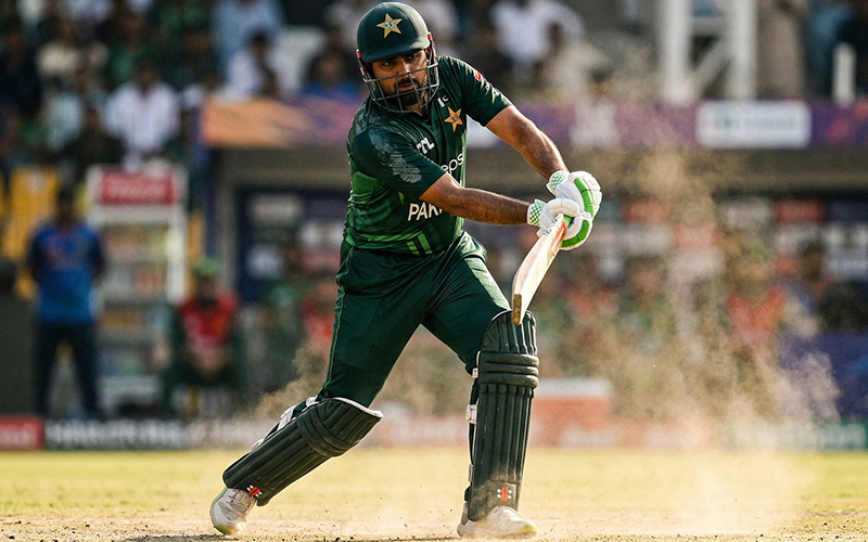 Pakistani cricketer playing in heat outdoors